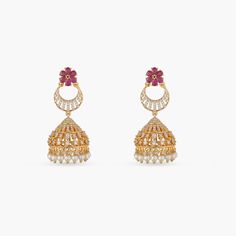 Description The Surabhi jhumki earrings by Tarinika are classic and versatile to style with any ethnic attire. The graceful pearl drops, CZ stones, and gold plating combines beautifully to add radiance to your look. Details & Specifications: Materials used: Brass Alloy with Yellow & White Gold Plating Weight - Earrings: 18.15 gm Length - Earrings: 5 cm Make it custom Want to make it a custom earring? Sure! Reach out to us at support@tarinika.com and we’ll be happy to make possible modifications Temple Jewelry Jhumkas For Reception, Fusion Style Jhumkas For Festive Reception, Fusion Style Jhumkas For Reception Festive, Fusion Style Festive Jhumkas For Reception, Diwali Reception Drop Jhumkas Earrings, Fusion Style Jhumkas For Reception And Festive Occasions, Festive Fusion Pearl Earrings With Latkans, Diwali Reception Drop Jhumkas, Fusion Jhumkas With Latkans For Reception