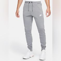 New With Tags Size: Medium Color: Gray Nike Tapered Leg Sports Bottoms, Nike Tapered Leg Bottoms With Pockets, Nike Sportswear Bottoms With Pockets, Nike Athleisure Tapered Leg Bottoms, Nike Athleisure Bottoms With Side Pockets, Nike Tapered Leg Athleisure Bottoms, Nike Gray Pants With Pockets, Nike Jogging Pants For Spring, Nike Casual Gray Bottoms