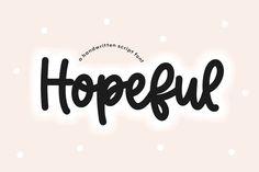 the word hopeful written in black ink on a pink background with white polka dots