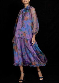 Floral organza, long sleeve, gathered hem dress, featuring front ribbon tie detail and cami lining. 100% Polyester