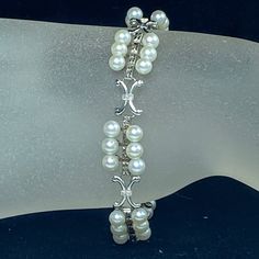 This Beautiful Sterling Silver Lady Bracelet From Original Mikimoto Collection, Circa 1960-1970's. Featuring Forty-Two (42) 4.8mm Akoya Pearls Comprises In Seven (7) Clusters, Each Cluster Was Set Six (6) Akoya Pearls. The Links Are Connect With "X" Cross Link. The Pearls Are In A Quality, There Are Minor Scratches On The Pearls. Each Cluster Is 17.63 X 14.8mm In Size. Tab Insert Clasp, 2" Safety Chain. Hallmark "M" In Clam Shell And "S", Stands For Sterling In Mikimoto. 7.5" Long, Weight 17.0gm. (1 Inch = 25.4 Mm; 1 Dime = 17.9mm). All Items Are Pre-Owned Unless Otherwise Stated. This Means They Have The Usual Aspects Of Pre-Owned Condition, Such As Light Scratches, Wear And Tarnish. If Mikimoto Jewelry, Safety Chain, Clam Shell, Akoya Pearls, Womens Jewelry Bracelets, Link Bracelets, Womens Bracelets, 1 Inch, Women Jewelry