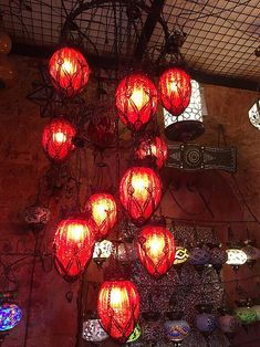 many red lanterns are hanging from the ceiling