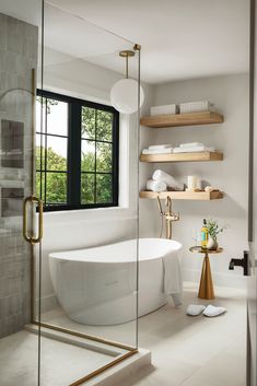 a white bath tub sitting next to a window