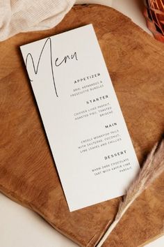 a menu card sitting on top of a wooden table