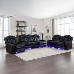 a living room with two reclining couches and a large rug on the floor