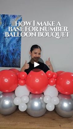 a woman sitting in front of balloons with the words how i make a base for number balloon bouquet