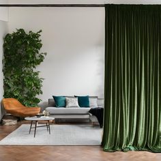 a living room with green curtains and furniture