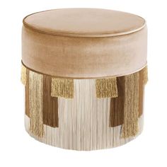 a round stool with tassels on it