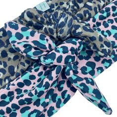 97% Cotton and 3% Polyester Approximately 2in W x 30in L* One Size Fits Most- Headband ties so can fit Infant to Adult Machine Wash Cold on Delicate Cycle, Lay Flat to Dry For every item sold, one headband is donated to a child with an illness. Adjustable Headband, Jaguar