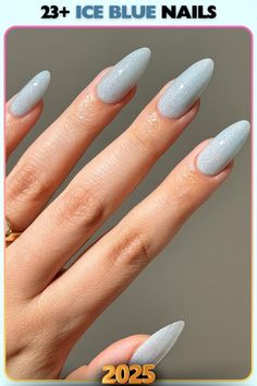 Shimmery ice blue nails with a matte texture. The soft glow creates a dreamy effect, ideal for pairing with cozy winter outfits or evening attire.