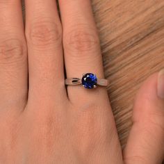 It is a lab sapphire ring. The main stone is 7mm*7mm round cut, weight about 1.66 carats. The basic metal is sterling silver and plated with rhodium. To change the metal to a solid gold (white/rose) or platinum is also available, please ask for a quotation if you want. You can also go to my shop Home for more elegant rings: https://www.etsy.com/shop/godjewelry?ref=hdr_shop_menu More sapphire rings: https://www.etsy.com/shop/godjewelry?ref=seller-platform-mcnav&section_id=20715031 Customizati Sapphire Jewelry With Tension Setting, Sapphire Ring With Tension Setting As Gift, Lab-created Sapphire Ring With Round Stone For Gift, Gift Lab-created Sapphire Ring With Round Stone, Gift Round Lab-created Sapphire Ring, Round Sapphire Ring With Tension Setting As A Gift, Blue Topaz Ring Engagement, Lab Created Engagement Rings, Silver Solitaire Engagement Ring