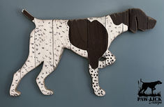 the dog is made out of wood and has spots on it