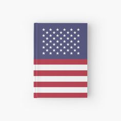 an american flag with stars on it hardcover notebooks are lined up against a white background