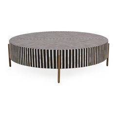 a black and white striped coffee table with wooden legs on an isolated surface, viewed from the front