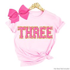 3rd Birthday Shirt Girl, 3rd birthday Outfit Three tshirt, Third Birthday Sweatshirt, 2nd Birthday Girl Shirt Chenille patches MORE BIRTHDAY SHIRTS HERE: https://etsy.me/3K1zlAK Shop with Confidence! We are a 5-Star Rated Shop operating since 2015! SIZING: * All sweatshirts are unisex, classic fit. Please refer to size chart in listing photos for details. * Easy measuring tip: Take your favorite shirt, lay it on a flat surface and measure the width (armpit to armpit) and length (top to bottom) * Pre-shrunk Pink Shirt For Birthday, Pink Party Shirt With Letter Print, Pink Letter Print Shirt For Birthday, Pink Letter Print Top For Birthday, Pink T-shirt For Birthday, Pink Crew Neck T-shirt For Birthday, Pink Crew Neck Top For Birthday, Pink Glitter Print Top For Birthday, Pink Number Print T-shirt For Birthday