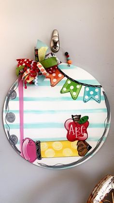 a plate that has some items on it and is hanging from the wall next to a pair of shoes