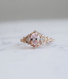 Enchanted Forest Pink Sapphire Ring. Moissanite Promise Ring. - Etsy Pinkengagement Rings, Elegant Rose Gold Sapphire Promise Ring, Heirloom Pink Sapphire Ring For Wedding, Pink Gold Rose Cut Diamond Wedding Jewelry, Heirloom Oval Rose Gold Diamond Ring, 14k Rose Gold Oval Center Stone Jewelry, Rose Gold Pink Sapphire Jewelry For Wedding, Pink Gold Jewelry With Rose Cut Diamonds For Weddings, Promise Pink Sapphire Ring