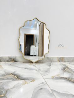 a mirror that is on the side of a wall