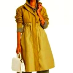 New Fashionably Chic Hoodied Trench Coat Rain Coat With Adjustable Cord At Waist For Styling And Synching The Waistline To Your Desired Fit And Comfort. The Coat Is Light Weight But Fully Lined For Coziness. Fabric Is Waterproof Size Medium Colorblock Taupe Nwt Spring Long Coat Parka With Pockets, Fitted Raincoat For Rainy Fall Weather, Trendy Spring Raincoat For Rainy Weather, Solid Spring Parka With Pockets, Spring Parka With Pockets, Fall Utility Raincoat, Khaki Parka For Fall Workwear, Trendy Winter Raincoat With Pockets, Spring Raincoat For Workwear