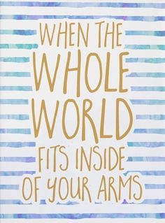 a card with the words, when the whole world fits inside of your arms