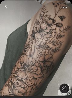 a woman's arm with flowers on it