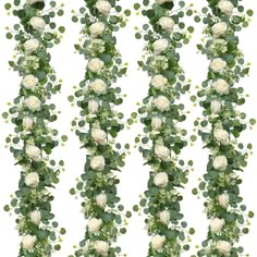 white roses and greenery are arranged in rows