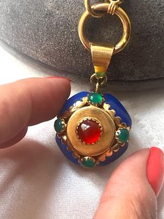 This is a beautiful Italian Vintage 14k Gold, Carnelian, Chalcedony & Green Agate Pendant. The colors are stunning and it looks beautiful on a simple or long chain. The pendant measures 1 inch (1.5 including the bail).  Necklace Weight: 12.9 grams Excellent vintage conditions. Thank you for visiting Boudoir Vintage!   Please feel free to contact me for further information or photos.  I offer international shipping. Your item will be packed with extreme care and will be shipped within 3-5 working Elegant Carnelian Gemstones For Gifts, Elegant Carnelian Gemstones As Gifts, Elegant Carnelian Gemstones As A Gift, Yellow Gold Chalcedony Jewelry Gift, Artsy Yellow Gold Jewelry With Carnelian Stones, Vintage Chalcedony Round Jewelry, Vintage Chalcedony Jewelry, Elegant Carnelian Round Pendant Jewelry, Luxury Agate Cabochon Jewelry