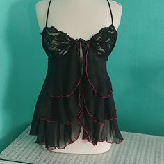 Black And Red Chemise. Ties At Top And Opens. Elastic In The Back Lace Detailing And Adjustable Straps. Never Worn And In Excellent Condition. Size Large. Black Coquette Tops For Party, Black Coquette Party Tops, Black Sleeveless Coquette Top, Black Flirty Camisole Top, Flirty Black Camisole Top, Fitted Black Night Tops, Black Sheer Tops For Night, Black Fitted Top For Night, Black Coquette Camisole Top