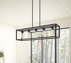 This 5 light rectangular chandelier is unique and perfect decoration for the modern or farmhouse home, minimal lines and modern tones give the light an edge that never disappoints. The corners of its simple cage frame are accented by square blocks, all finished in a deep earth black with clear glass. Perfectly for kitchen island, dining room, living room, cafe, bar, club, warehouse, hallway. Aiwen 5-Light Black Farmhouse Chandelier | US-DK-CIC-B5 Black Iron Light Fixtures, Dining Room Light Fixtures Rectangle, Dining Room Black Light Fixtures, Modern Farmhouse Dining Room Chandelier, Frame Kitchen Island, Townhouse Upgrades, Rectangle Light Fixture, Farmhouse Chandelier Dining Rooms, Farmhouse Dining Room Chandelier