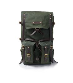 The Freefolk Bushcraft Backpack in Army Green and solid brass hardware. This bag has been handcrafted for adventures or peaceful time in the woods. You can easily fit IN and ON the bag all your gear and supplies needed for weeks in the wilderness. Made of genuine leather, solid brass or stainless steel hardware and quality waxed canvas Freefolk won't let you down. We are waxing canvas ourselves, blending four ingredients to meet the best resistance possible. Beeswax included in the blend comes f Practical Standard Backpack For Camping, Rugged Rectangular Backpack For Outdoor, Rectangular Waxed Leather Backpack For Outdoor, Rugged Outdoor Rectangular Backpack, Rectangular Leather Backpack With Waxed Finish For Outdoor, Handmade Outdoor Standard Backpack, Handmade Outdoor Backpack, Rectangular Waxed Canvas Outdoor Backpack, Waxed Canvas Bags For Camping