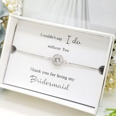 a bridesmaid bracelet in a box with the message i couldn't say i was without you