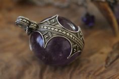 Materials: Sterling silver, amethyst, leather cord. Size can vary slightly on the pendants depending on how the stone was cut, all sizes are diameter of the piece, except for the oblong shapes which are measured by height. This stunning pendant is a sized-down replica of one of the original Visby lenses used in Viking Gotland around 1000 years ago. It comes on a leather cord embellished with two traditionally crafted glass beads. Please note the sterling silver chain is not included if you wish Viking Wedding, 1000 Years, Ball Pendant, Amethyst Pendant, Rock Crystal, Sterling Silver Chain, Leather Cord, Sterling Silver Chains, Silver Chain