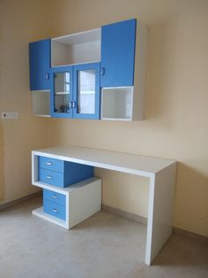 a blue and white desk in an empty room