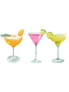 three different colored cocktail glasses with limes and lemon wedges