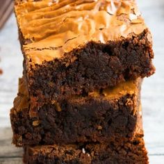 two brownies with frosting stacked on top of each other