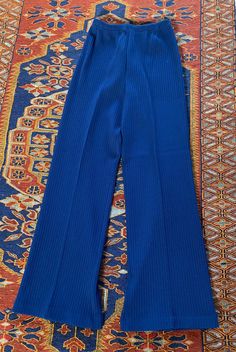 "Vintage 1970's blue poly/acrylic pull on pants with elastic waist made by Whistlers.  28\" waist unstretched, 29\" inseam, 40\" length Unworn deadstock with original tags, great condition!" Vintage Stretch Bottoms With Elastic Waistband, Retro Stretch Blue Bottoms, Retro Blue Stretch Bottoms, Retro High Waist Blue Pants, Vintage Stretch Blue Bottoms, Vintage Blue Stretch Bottoms, Blue Vintage Stretch Bottoms, Blue Stretch Vintage Bottoms, Vintage High Waist Blue Bottoms