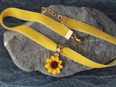 "Velvet ribbon choker with sculpted flower. Material of flower is polymer clay. Material of findings are zinc alloy in gold plated. Each petal of flower made by hand Dia flower about 18 mm/ 0.7 \" Length of choker is adjustable: 9-11 inches/ 22,8- 27,9 cm 10-12 inches/ 25,4 - 30, 5 cm 11-13 inches/ 28-33 cm 12-14 inches/ 30.5- 35.5 cm 13-15 inches/ 33-38 cm 14-16 inches/ 35.5 cm-40.5 cm 15-17 inches/ 38 cm- 43 cm 16-18 inches/ 40.6 cm- 45.7 cm 17-19 inches/ 43 cm - 48 cm 18-20 inches/ 45,7-50,8 Adjustable Yellow Choker Jewelry, Flower Charm Choker As A Gift, Flower Decoration Choker Necklace Gift, Flower Decoration Choker Necklace For Gift, Flower Decorated Choker Necklace For Gifts, Flower Shaped Choker With Flower Charm As Gift, Floral Choker With Flower Charm As A Gift, Gift Flower Pendant Adjustable Choker, Adjustable Choker Necklace With Flower Decoration