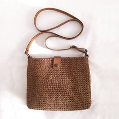 Trendy and modern crochet bag DETAILS Material: Textile yarn 80% cotton 20% polyester Dimensions: 23×18.5×2.5 cm (9''x7.25''x1'') Color brown With leather lid, long leather straps 120cm (47'') Metal color bronze With inner lining Additional information on care Washable at 30o Dry on a horizontal surface Don't tweak or twist All bags are made in a smoke and pet free room. Please note that colors may vary slightly from photos due to different monitor settings. Everyday Woven Leather Jute Shoulder Bag, Beige Crochet Bucket Bag For Everyday, Beige Crochet Bag With Woven Leather For Daily Use, Beige Woven Leather Crochet Bag For Everyday Use, Beige Crochet Bag With Woven Leather For Everyday, Everyday Beige Crochet Bag With Woven Leather, Casual Crochet Satchel Bag With Woven Leather, Casual Crochet Shoulder Bag With Woven Leather, Daily Use Brown Crochet Bag With Woven Leather