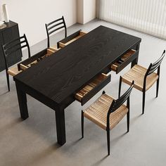 a dining table with four chairs around it