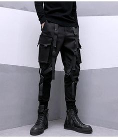 Dominate the urban battlefield in our darkwear cargo pants. Experience the Darkwear Pants, the epitome of tactical streetwear that transforms the courageous urban dweller into a figure of intrigue and allure. Imagine yourself striding confidently down the concrete jungle, your stride unhindered and your style unmatched, a living, breathing testament to the elegant power of future streetwear. Every feature of these unique pants serves to enhance your commanding presence. The darkwear cargo pants, Winter Techwear Parachute Pants, Techwear Style Cargo Pants For Streetwear, Urban Cargo Jeans With Cargo Pockets For Urban Adventures, Urban Style Cargo Jeans For Urban Adventures, Techwear Bottoms With Cargo Pockets For Urban Adventures, Urban Pants With Multiple Pockets For Urban Adventures, Urban Cargo Pants With Belt Loops For Outdoor, Urban Cargo Pants For Adventures, Techwear Cargo Pants With Multiple Pockets For Urban Adventures