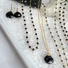 Beautifully faceted Black Spinel Briolette is hand-wrapped into a pendant and dangles from a long bar & link chain. Finished off with spring ring clasp and a dangle of gold beads. All gold-filled components. Length 28".The Black Spinel measures 15mm X 12mm. § Great to accent those pretty Holiday sweaters. § Great for layering! * All jewelry comes packaged in gift box with pink organza ribbon.* Care instructions also included. Wire Wrapped Drop Jewelry For Party, Minimalist Wire Wrapped Briolette Jewelry, Wire Wrapped Briolette Jewelry For Party, Gold Teardrop Faceted Beads Jewelry, Gold Teardrop Jewelry With Faceted Beads, Gold Drop Jewelry With Faceted Beads, Elegant Briolette Jewelry With Faceted Beads, Minimalist Faceted Briolette Jewelry, Gold Teardrop Jewelry With Beaded Chain