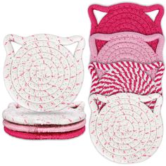 pink and white cat coasters are stacked on top of each other in different patterns