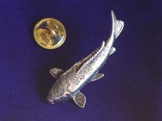 * This beautiful pin badge is crafted from lead-free pewter and measures 4cm long. * A perfect present for yourself or any other Koi carp fan. It comes complete with a velveteen gift pouch. Silver Lapel Pin With Metal Pinmount Logo For Gift, Silver Lapel Pin With Metal Pinmount Logo As Gift, Carpe Koi, Koi Carp, Silver Fish, Long A, Gift Pouch, Carp, Lapel Pin