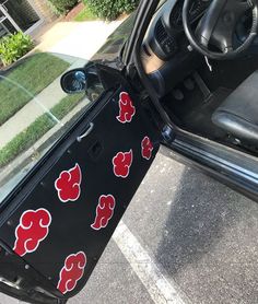 the interior of a car with stickers on it's door and window panels