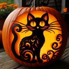 a carved pumpkin with an image of a cat on it