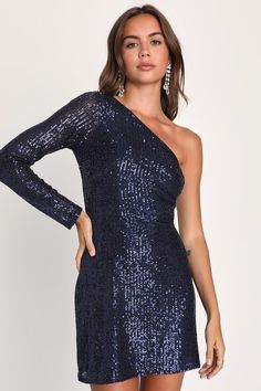 Being the life of the party is easy with a remarkable look like the Lulus All Time Shine Navy Blue Sequin One-Shoulder Mini Dress! Glittering sequins dazzle across a stretchy mesh overlay (atop a matching knit liner) that shapes a trendy one-shoulder neckline and a sheer long sleeve. The fitted waist tops a flirty bodycon skirt that finishes at a modern mini hem. Hidden side zipper/clasp. Fit: This garment fits true to size. Length: Mid-thigh. Size medium measures 32" from shoulder to hem. Bust: Blue One Shoulder Dress For Prom Party, Blue One-shoulder Dress For Prom Party, Blue One-shoulder Dress For Prom Season Party, Glamorous Blue One-shoulder Prom Dress, Glamorous Stretch One Shoulder Dress For Night Out, Glamorous One Shoulder Stretch Dress For Night Out, Blue One Shoulder Party Dress, Holiday Fitted One Shoulder Sequin Dress, Stretch One Shoulder Dress For Party