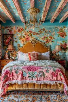 a bedroom with floral wallpaper and chandelier above the bed is decorated in pastel colors