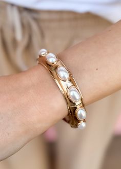 Slip this dainty bracelet on and complete your look! oval pearl stretch bracelet gold lightweight imported Spring Gold Jewelry With Pearl Drop, Spring Pearl Drop Gold Jewelry, Elegant Gold Stretch Bracelet For Formal Occasions, Elegant Spring Bangle Jewelry, Spring Pearl Gold Jewelry, Spring Gold Pearl Jewelry, Elegant Spring Bangle, Elegant Gold Stretch Bracelet For Party, Trendy Gold Pearl Bracelet