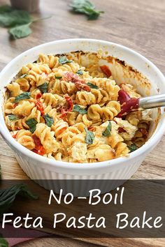 no - boil feta pasta bake in a white dish with basil leaves on the side