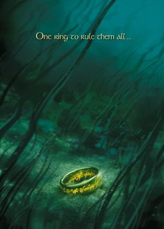 lord of the rings movie poster with two gold wedding bands in underwater grass and seaweed